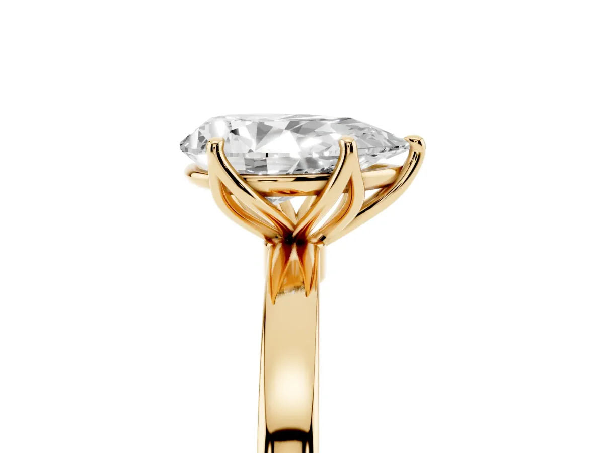 Pear Cut Diamond Solitaire Ring with Thin Band and Prong Setting Yellow gold