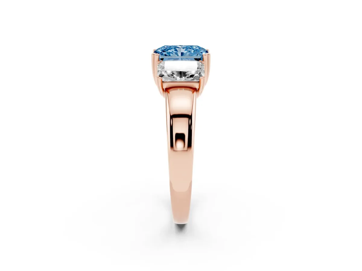 Fancy Blue Three-Stone Radiant Cut Cut Diamond Ring with Channel Set Band and Four-Prong Setting Rose gold