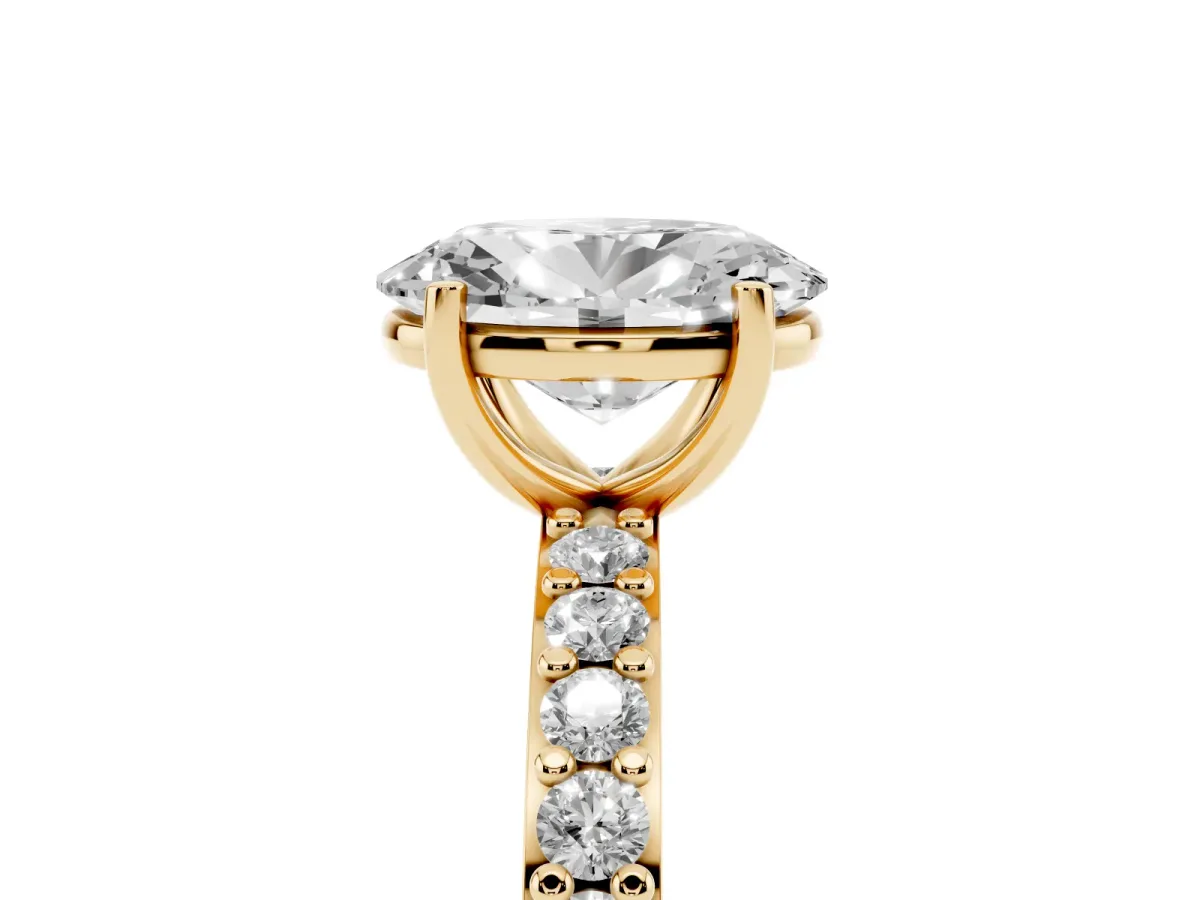 Oval Cut Cut Diamond Solitaire with Pave Band and Four-Prong Setting Yellow gold