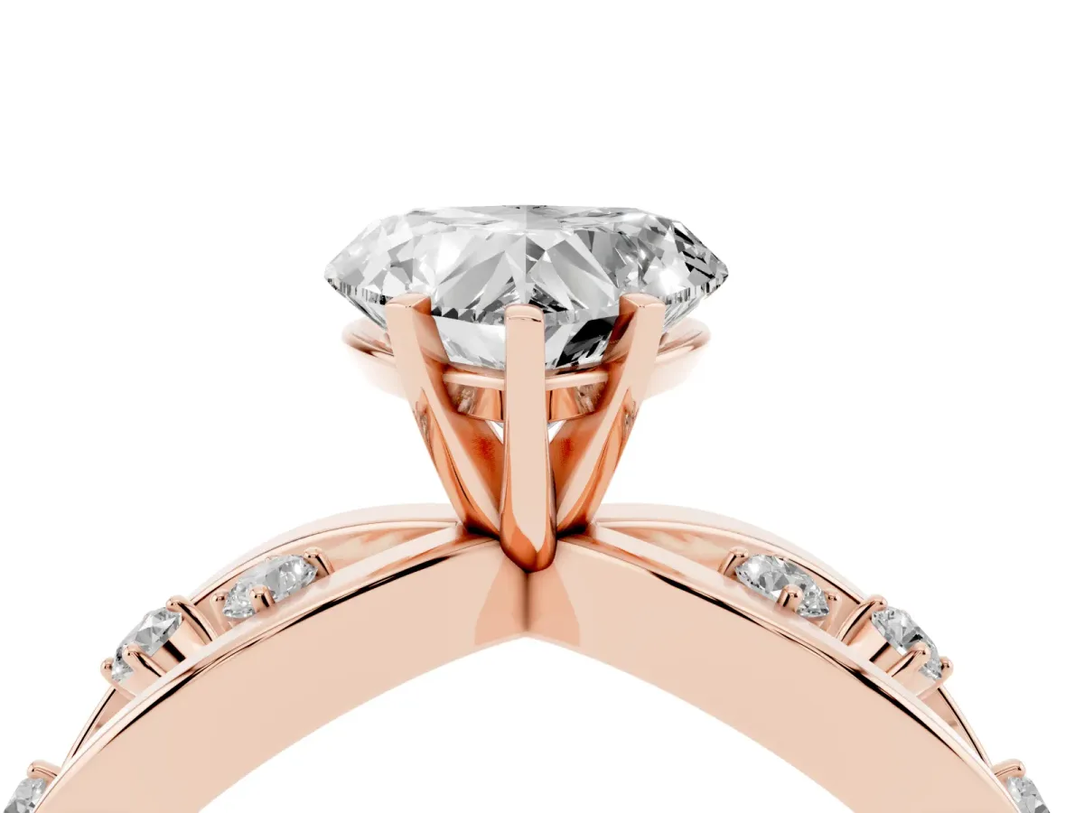 Heart Cut Cut Solitaire Diamond with Side Stones on Criss-Cross Band and Four-Prong Setting Rose gold