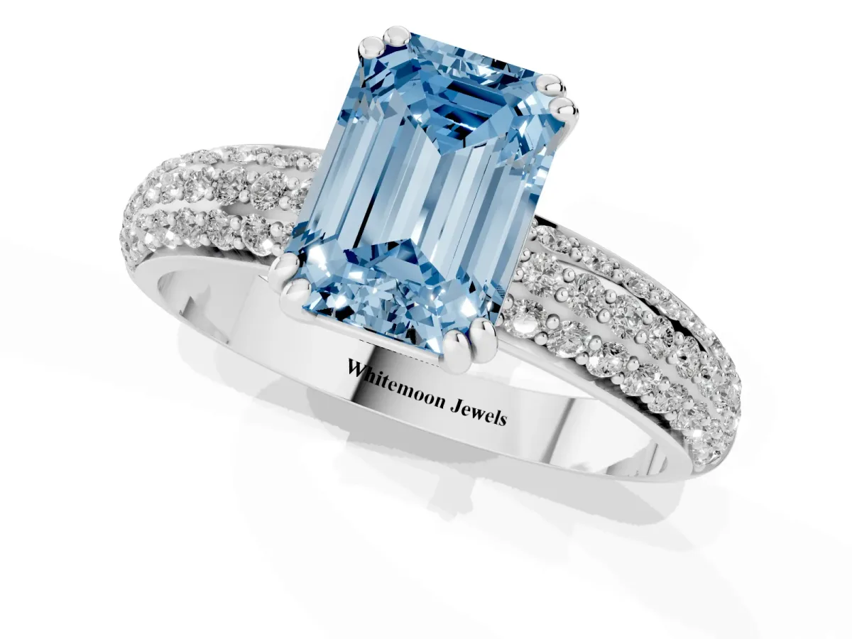 Fancy Blue Emerald Cut Diamond Solitaire Ring with Multi-Row Round Pavé Band and Prong Setting Silver