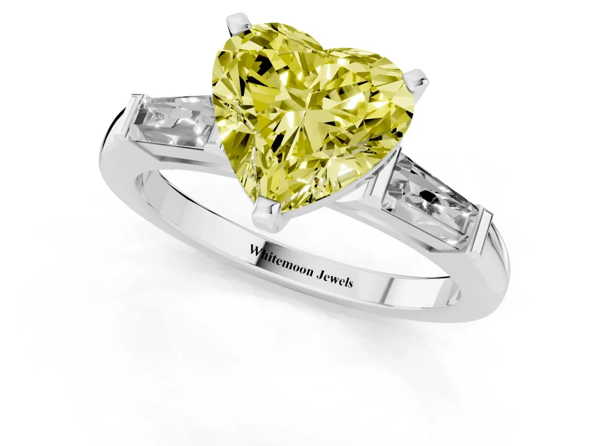 Fancy Yellow Heart Cut Solitaire with Tapered Baguette Side Stones on a Classic Band with Four-Prong Setting Platinum
