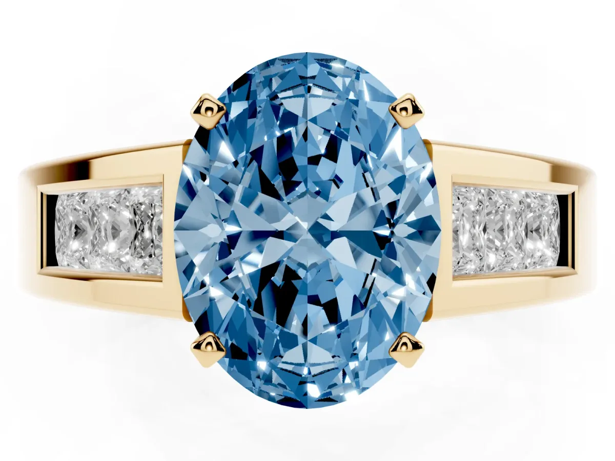 Fancy Blue Oval Cut Cut Channel Set Solitaire Ring with Four-Prong Setting Yellow gold