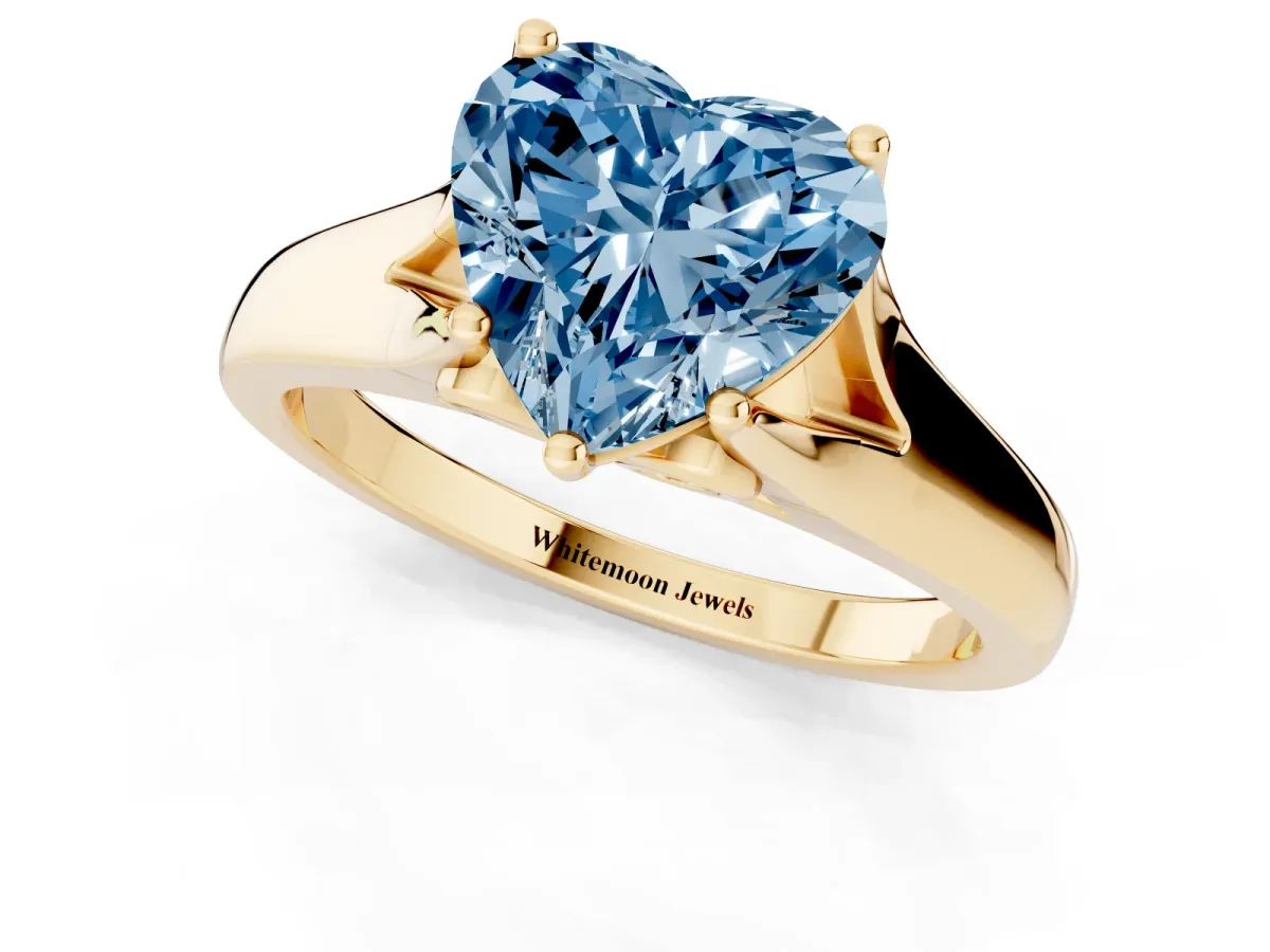 Fancy Blue Heart Cut Solitaire Diamond Ring with Cathedral Band and Four-Prong Setting Yellow gold