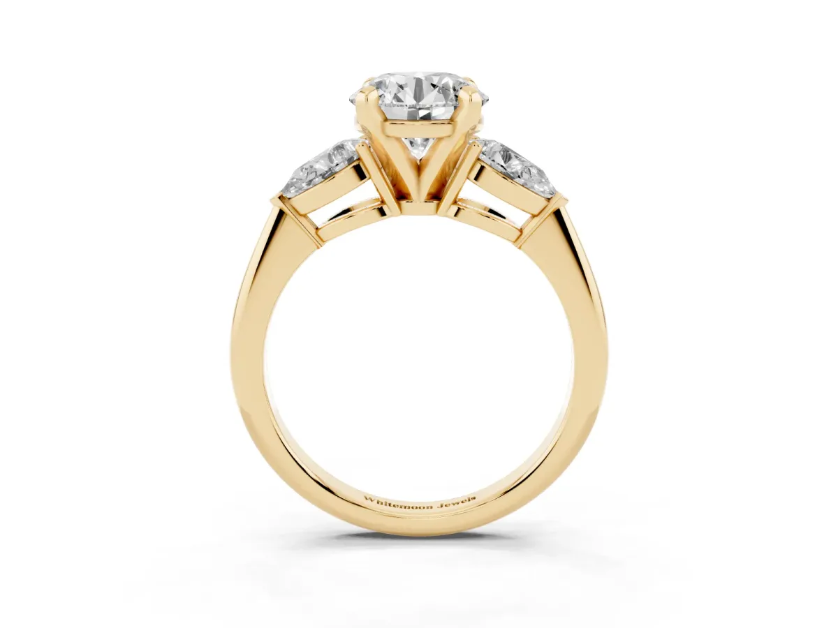 Three-Stone Round Cut Diamond Ring with Pear Side Stones and Four-Prong Setting Yellow gold