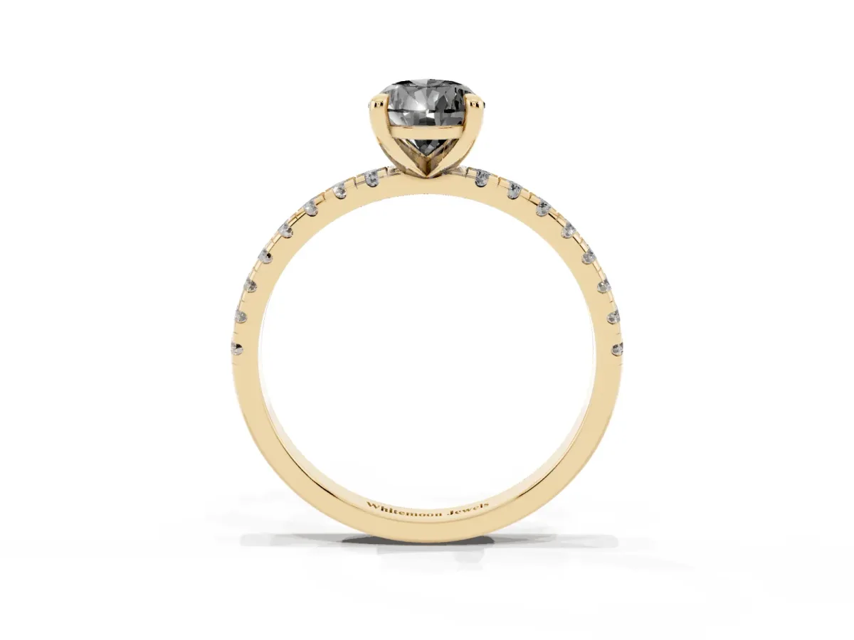 Fancy Black Pear Cut Diamond Brilliant Solitaire Ring with Pavé Band and Four-Prong Setting Yellow gold