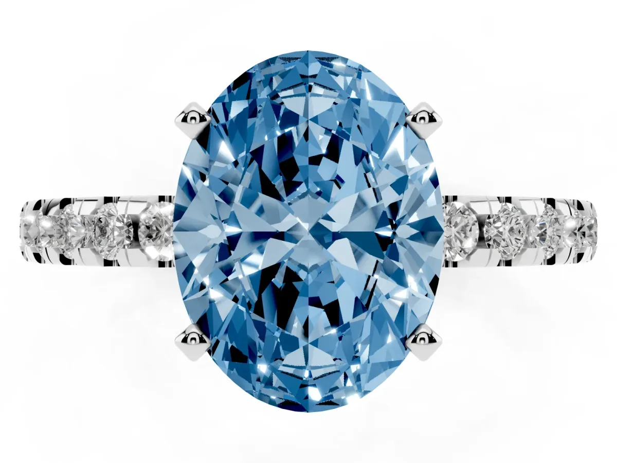 Fancy Blue Oval Cut Diamond Solitaire Ring with Round Pavé Band and Four-Prong Setting Silver