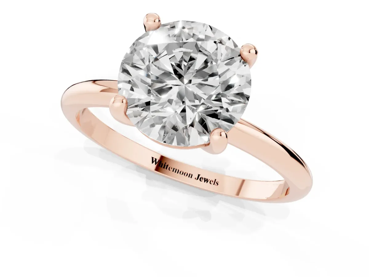 Round Cut Solitaire Diamond Ring with 4-Prong Setting on a Classic Band Rose gold