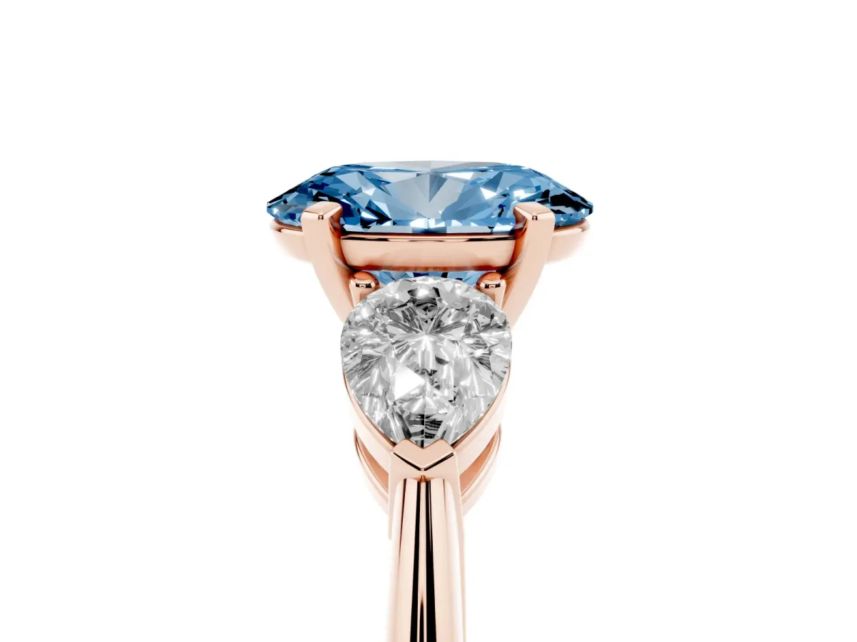Fancy Blue Three-Stone Oval Cut Diamond Ring with Pear Side Stones and Four-Prong Setting Rose gold