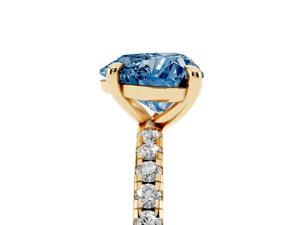 Fancy Blue Heart Cut Diamond Brilliant Solitaire Ring with Pavé Band and Four-Prong Setting Yellow gold