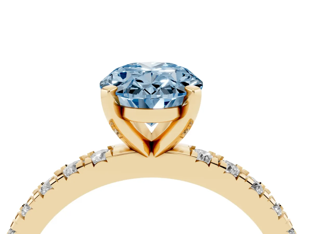 Fancy Blue Oval Cut Diamond Pavé Band Solitaire with Four-Prong Setting Yellow gold