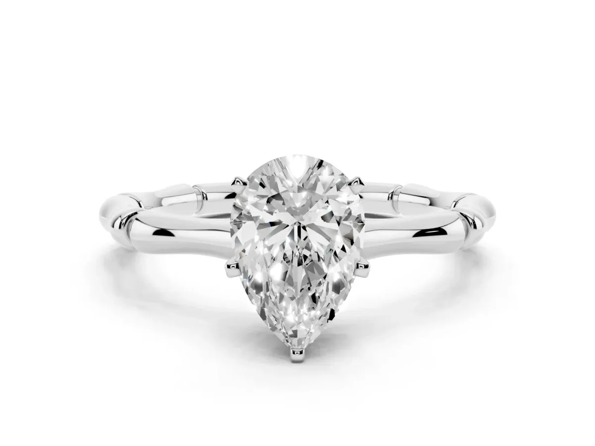Pear Cut Solitaire Diamond Ring with Bamboo Band and Four-Prong Setting Platinum
