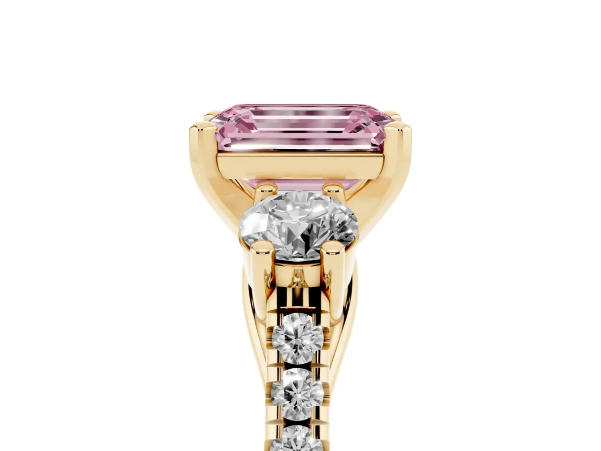 Fancy Pink Three-Stone Emerald Cut Diamond Pavé Band with Four-Prong Setting Yellow gold