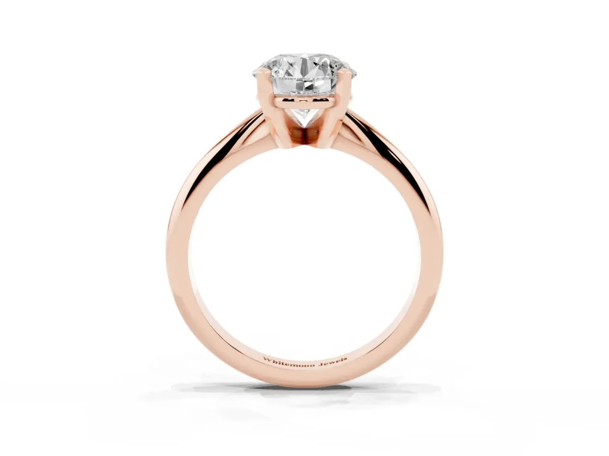 Round Cut Cut Solitaire Ring with Four-Prong Setting on a Classic Band Rose gold