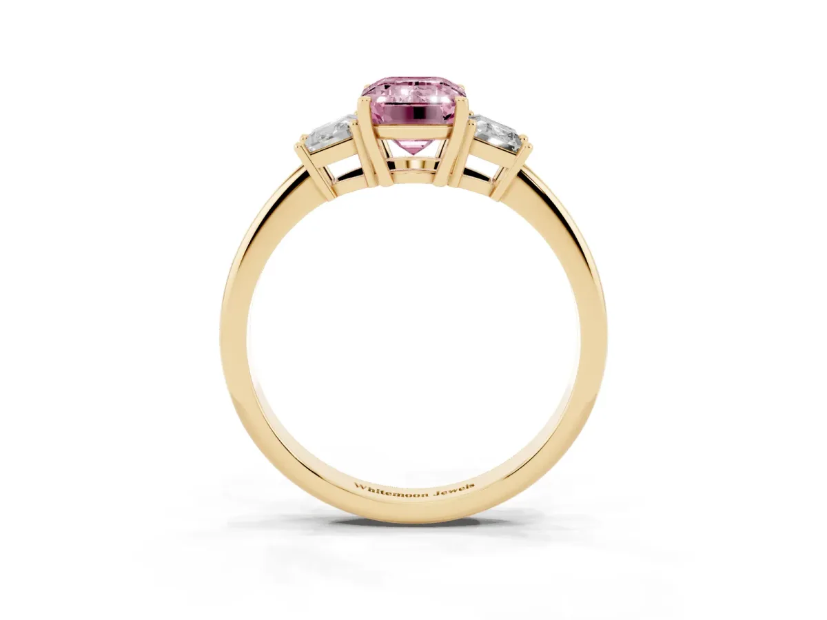 Fancy Pink Emerald Cut Diamond Three-Stone Ring with Trapezoid Side Stones and Prong Setting Yellow gold