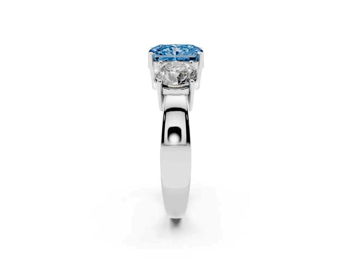 Fancy Blue Three-Stone Radiant Cut Diamond Ring with Round Side Stones, Classic Band, and Four-Prong Setting Platinum