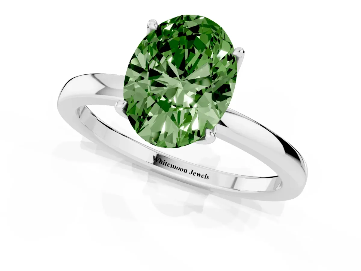 Fancy Green Oval Cut Diamond Solitaire Ring with Thin Band and Prong Setting White gold