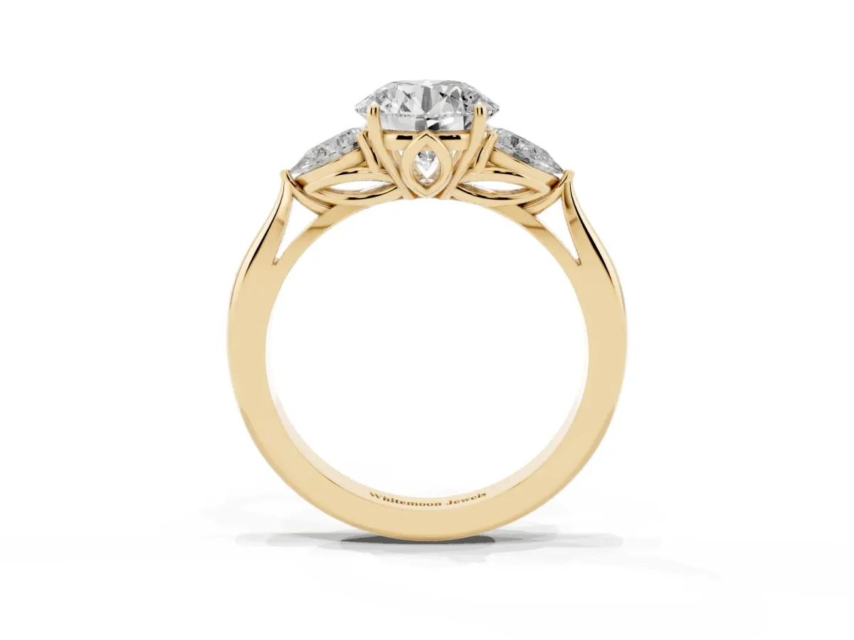 Three-Stone Round Cut Diamond Ring with Pear Side Stones in Four-Prong Setting Yellow gold