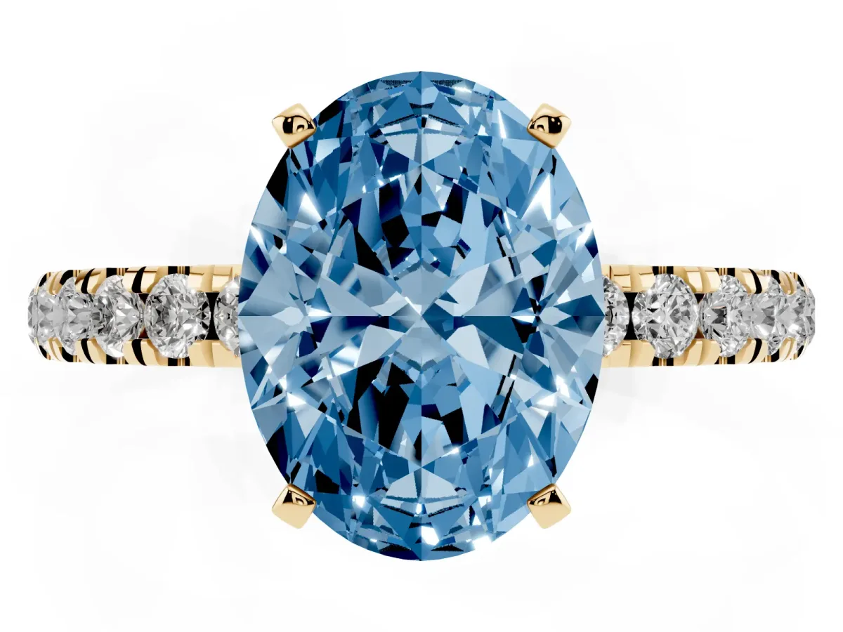 Fancy Blue Oval Cut Diamond Solitaire Ring with Pavé Accents and Four-Prong Setting Yellow gold
