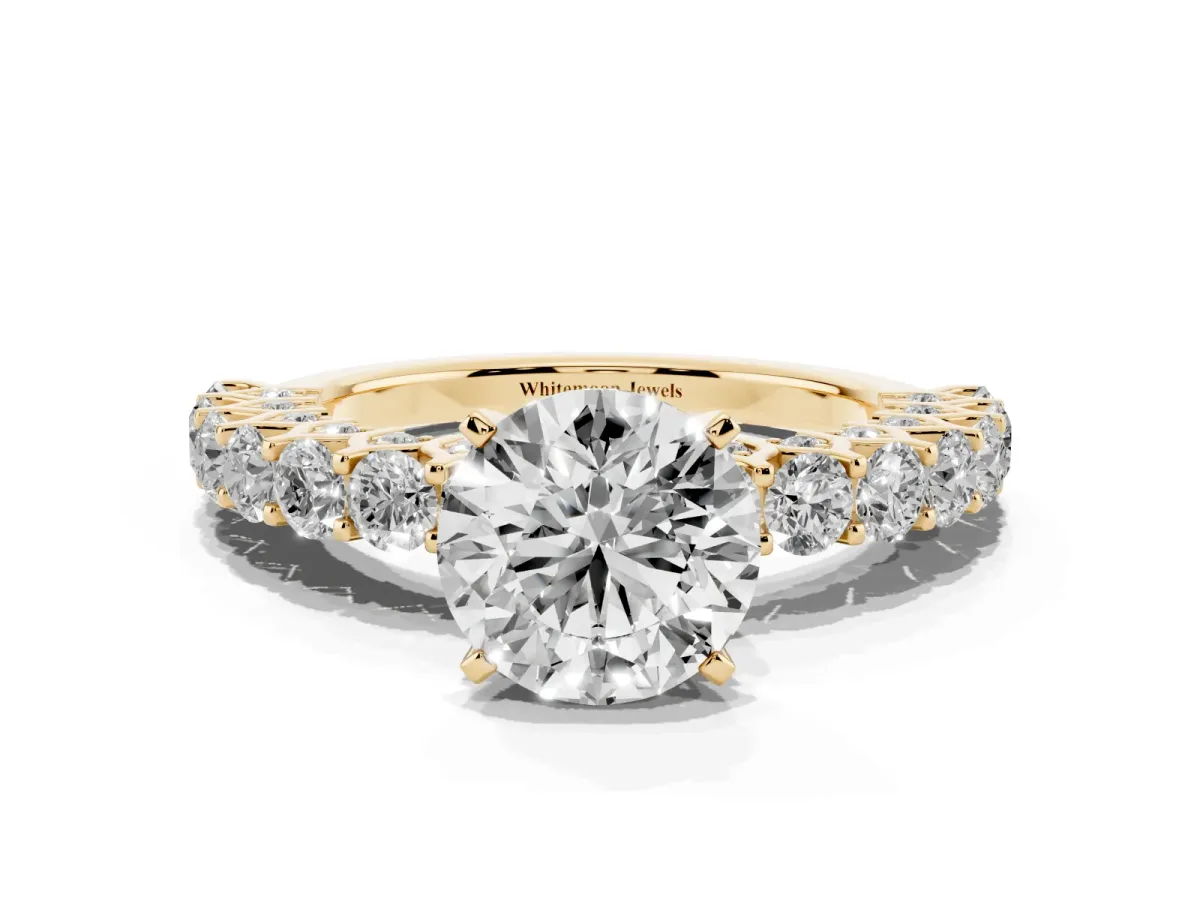 Round Cut Diamond Solitaire Ring with Shared Prong Pavé Band and Four-Prong Setting Yellow gold