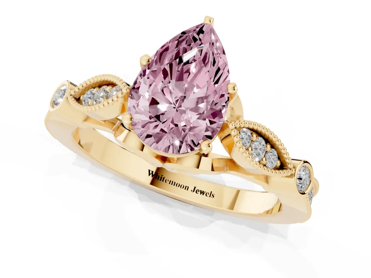 Fancy Pink Pear Cut Cut Diamond with Milgrain Marquise and Bezel Accents on a Solitaire Band with Prong Setting Yellow gold
