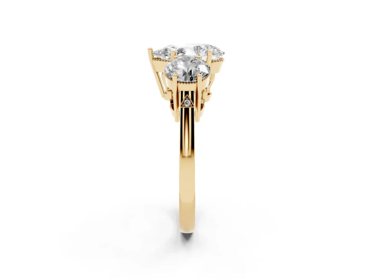 Three-Stone Pear Cut Diamond Engagement Ring with Prong Setting on a Classic Band Yellow gold