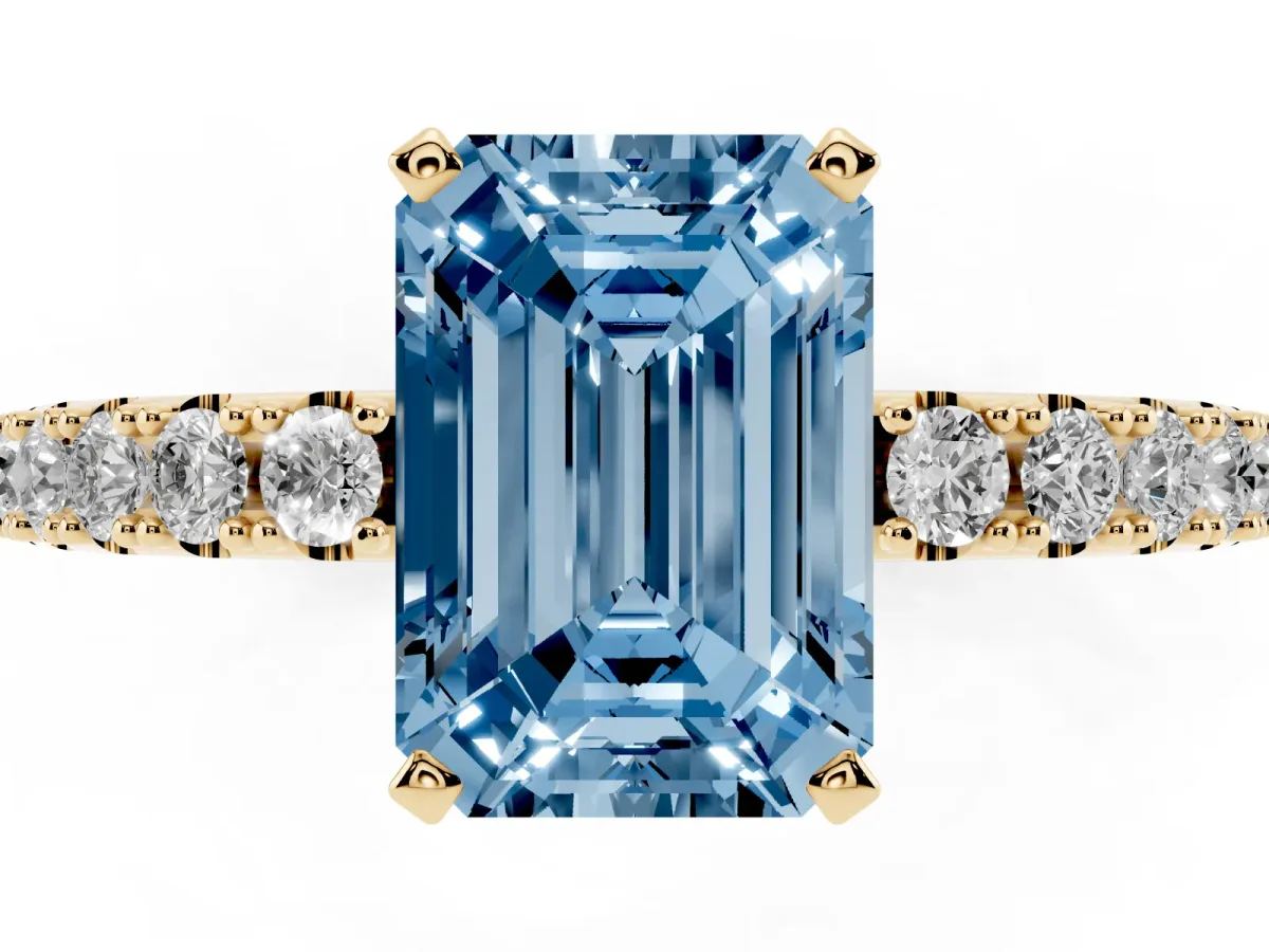 Fancy Blue Emerald Cut Diamond Solitaire Pavé Band with Four-Prong Setting Yellow gold