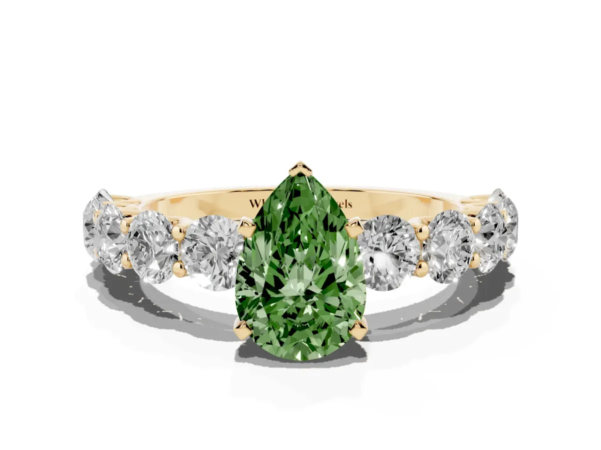 Fancy Green Pear Cut Diamond Prong Setting with Side Stones on a Pave Band Yellow gold
