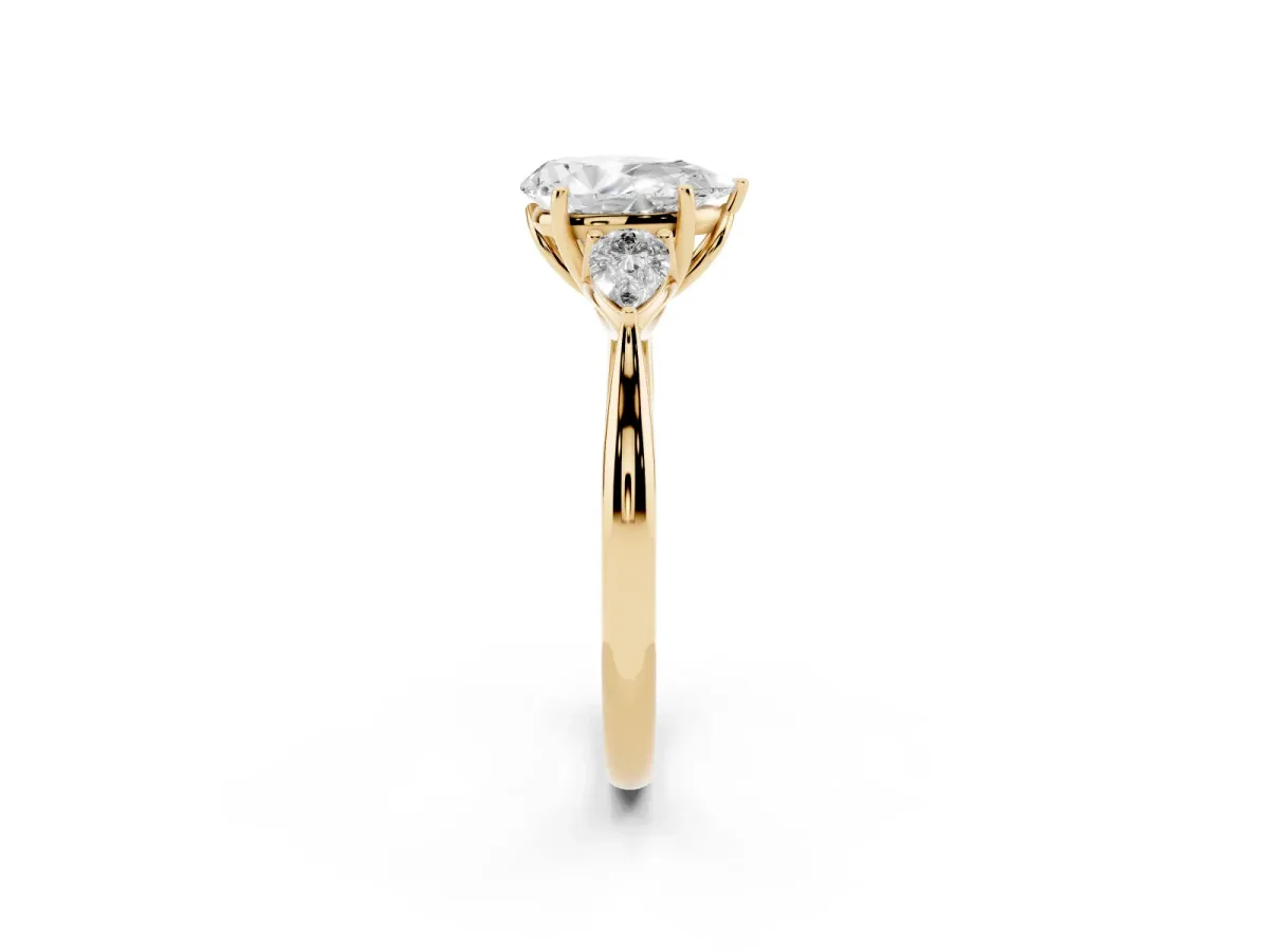 Pear Cut Diamond Three-Stone Ring with Pear Side Stones and Prong Setting Yellow gold