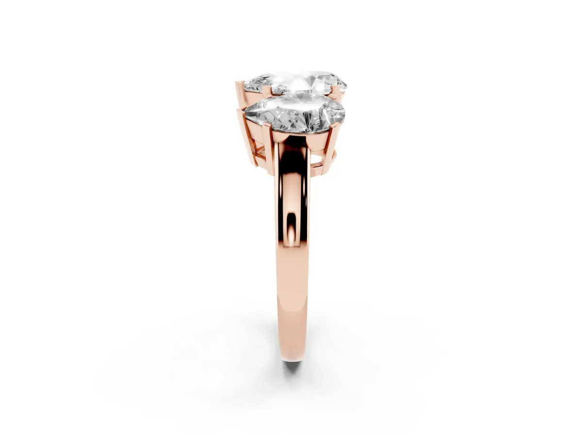 Three-Stone Pear Cut Cut Diamond Ring with Channel Set Band and Four-Prong Setting Rose gold