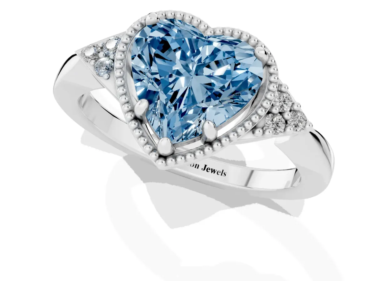 Fancy Blue Milgrain Heart Cut Cut Diamond Ring with Tapered Pave Band and Four Prong Setting Platinum