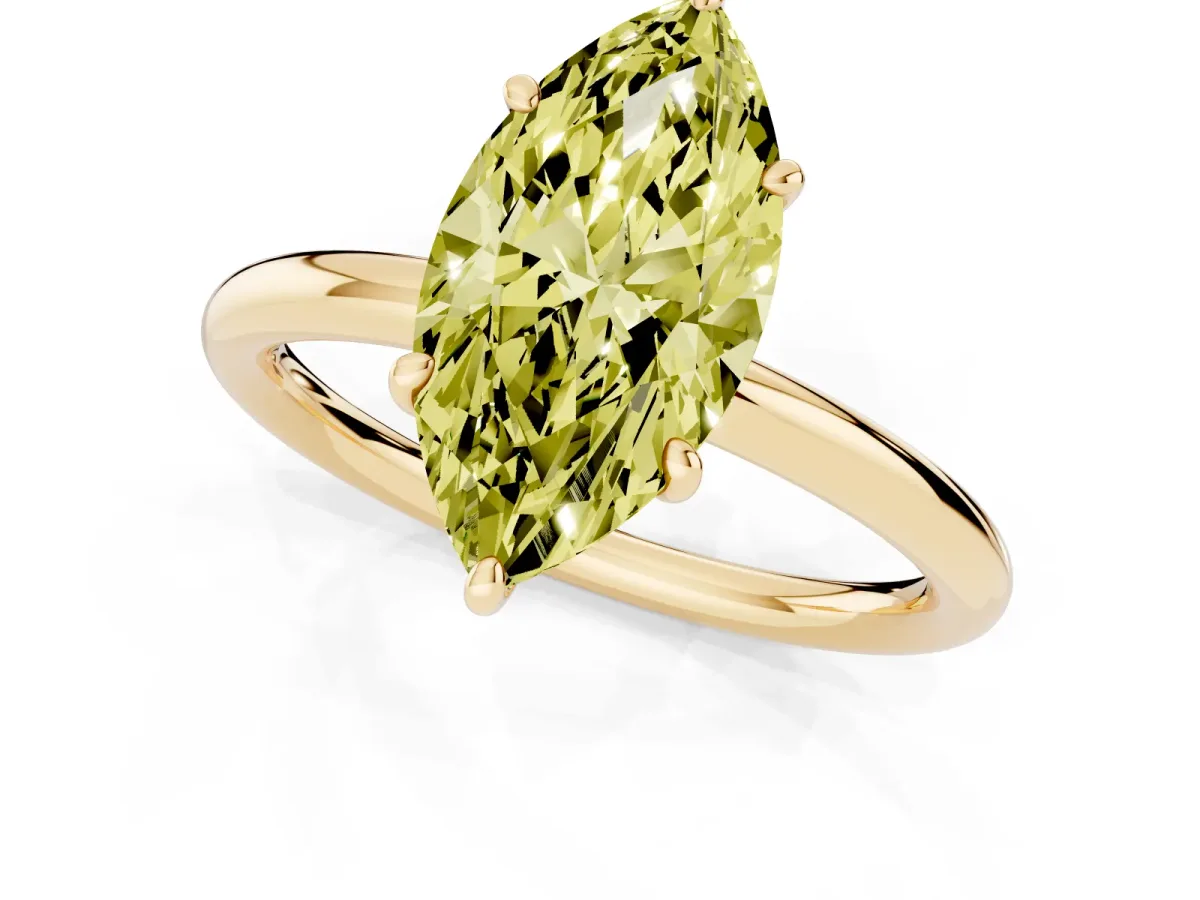 Fancy Yellow Oval Cut Solitaire Diamond Ring with Four-Prong Setting on a Plain Band Yellow gold