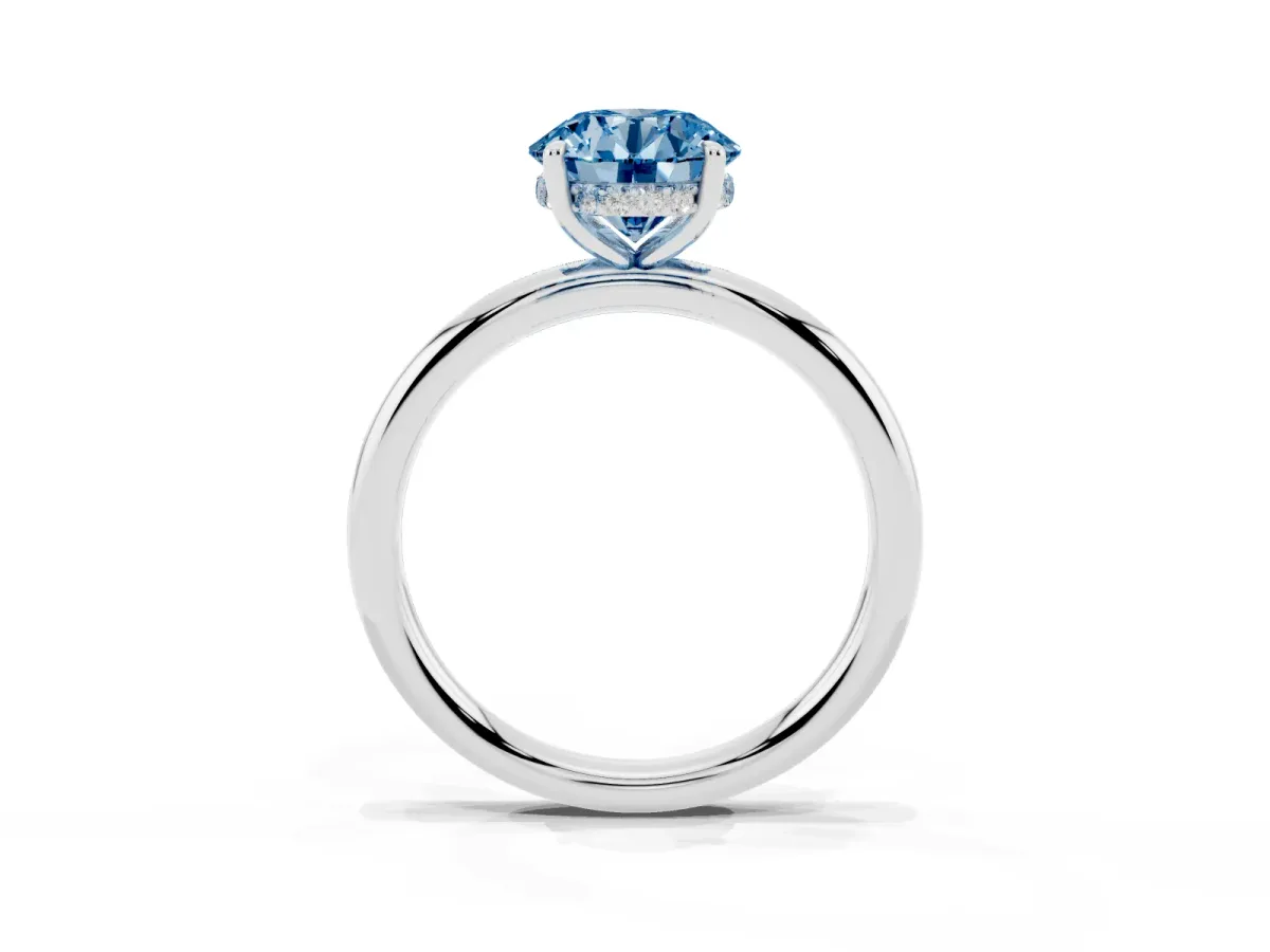 Fancy Blue Round Cut Diamond Solitaire Ring with Thin Band and Four-Prong Setting Silver