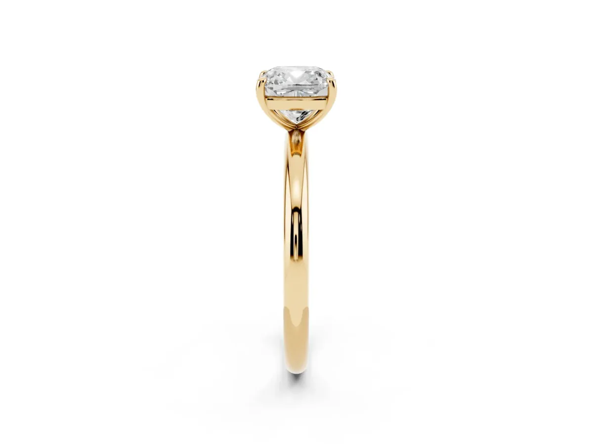 Cushion Cut Solitaire Diamond Ring with Four-Prong Setting on a Plain Band Yellow gold