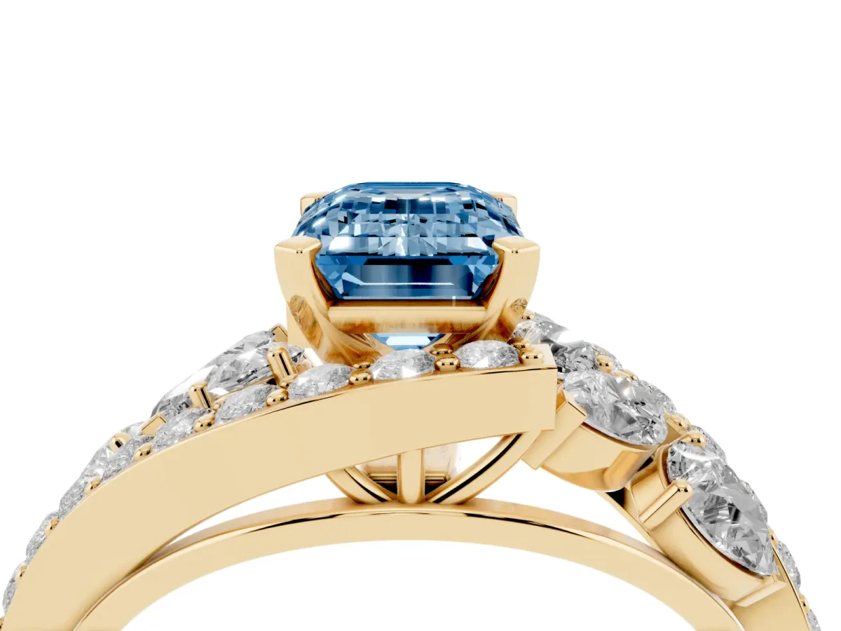 Fancy Blue Emerald Cut Diamond Halo Ring with Marquise and Pavé Band in Prong Setting Yellow gold