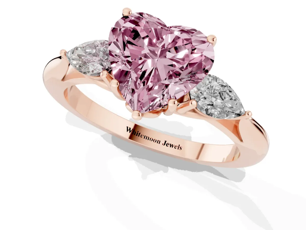 Fancy Pink Three-Stone Heart Cut Diamond Ring with Pear Side Stones in Four-Prong Setting Rose gold