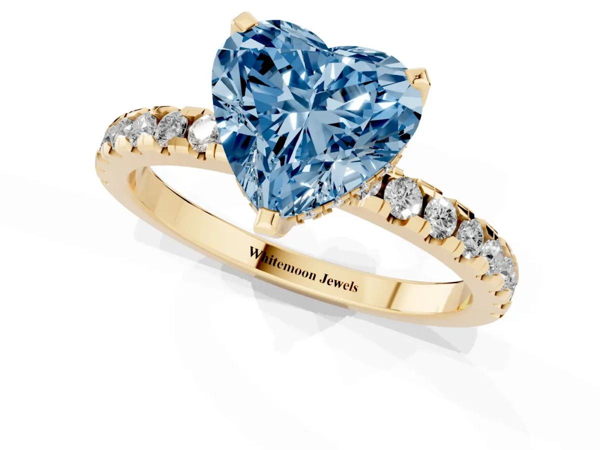 Fancy Blue Heart Cut Diamond Solitaire Ring with Round Pavé Band and Four-Prong Setting Yellow gold