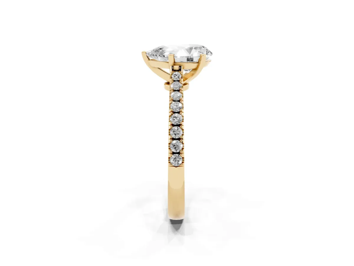Pear Cut Cut Solitaire Diamond Engagement Ring with Pave Band and Four-Prong Setting Yellow gold