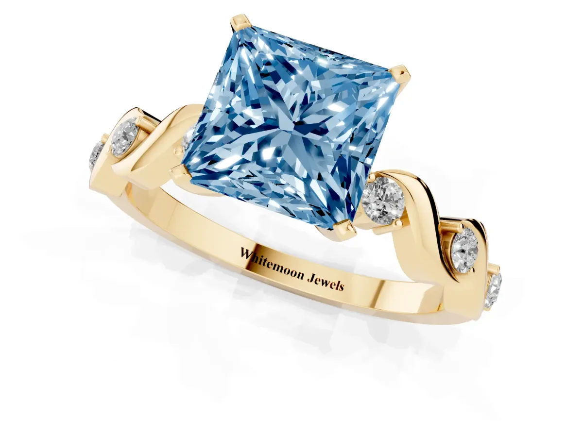 Fancy Blue Princess Cut Diamond Solitaire Twisted Band with Round Accents and Prong Setting Yellow gold