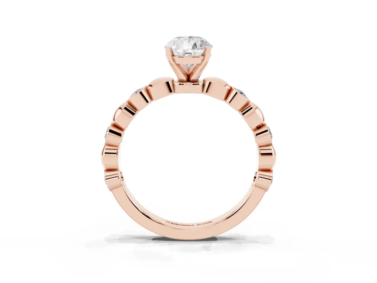 Pear Cut Solitaire Bezel-Set Diamond Ring with Beaded Band and Four-Prong Setting Rose gold
