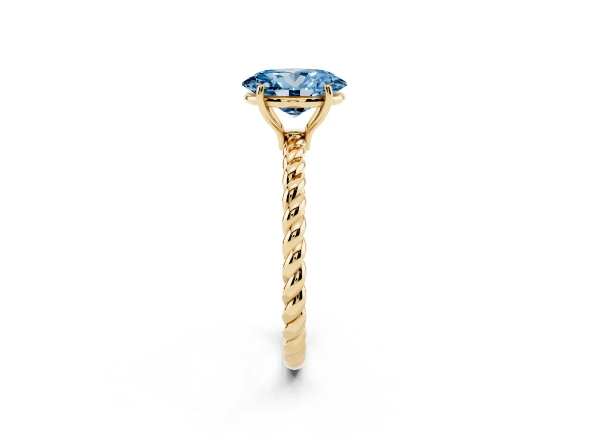 Fancy Blue Oval Cut Solitaire Twist Band Ring with Four-Prong Setting Yellow gold