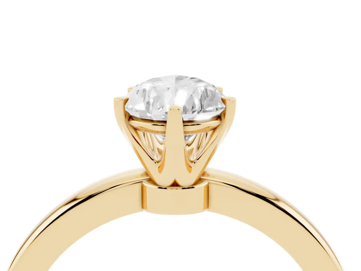 Pear Cut Solitaire Diamond Ring with Six-Prong Setting on a Classic Band Yellow gold