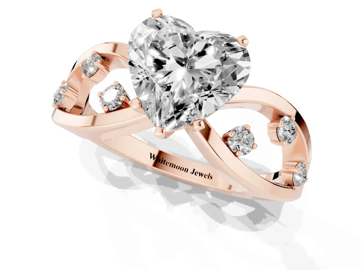 Heart Cut Cut Solitaire Diamond with Side Stones on Criss-Cross Band and Four-Prong Setting Rose gold