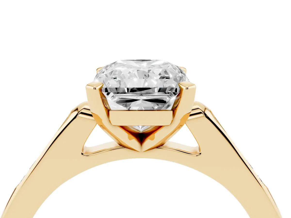 Radiant Cut Diamond Solitaire Ring with Channel Set Round Band and Prong Setting Yellow gold