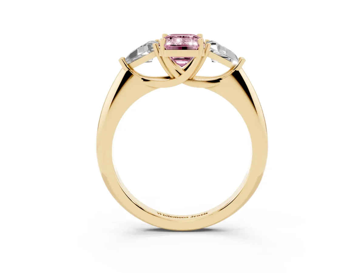 Fancy Pink Three-Stone Emerald Cut Diamond Engagement Ring with Trillion Side Stones and Prong Setting Yellow gold