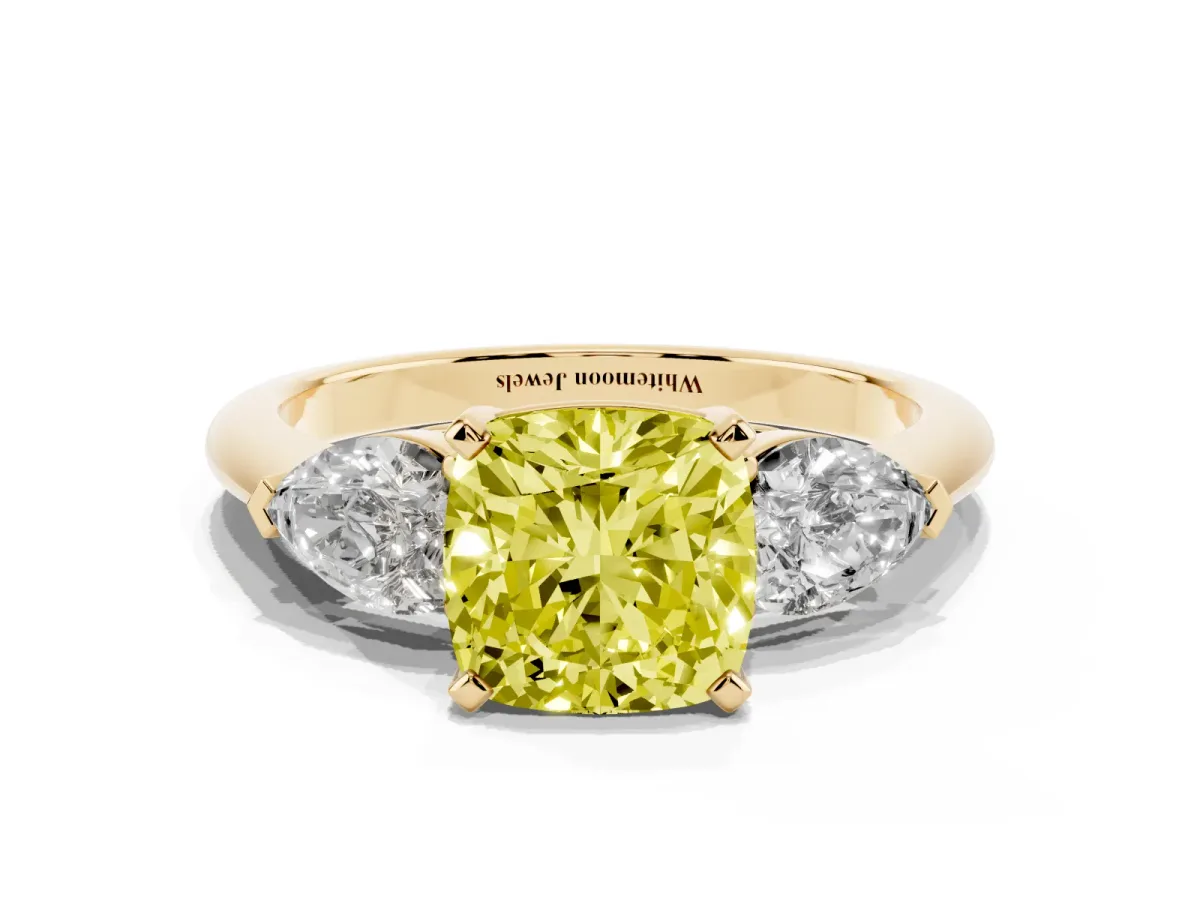 Fancy Yellow Three-Stone Cushion Cut Diamond Ring with Pear Side Stones and Four-Prong Setting Yellow gold