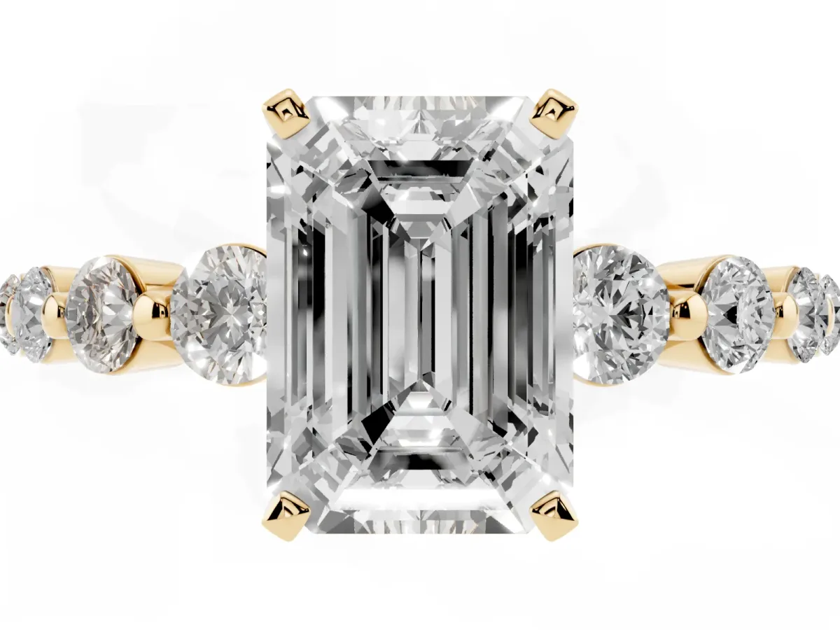 Emerald Cut Solitaire Diamond Ring with Pave Band and Four-Prong Setting Yellow gold