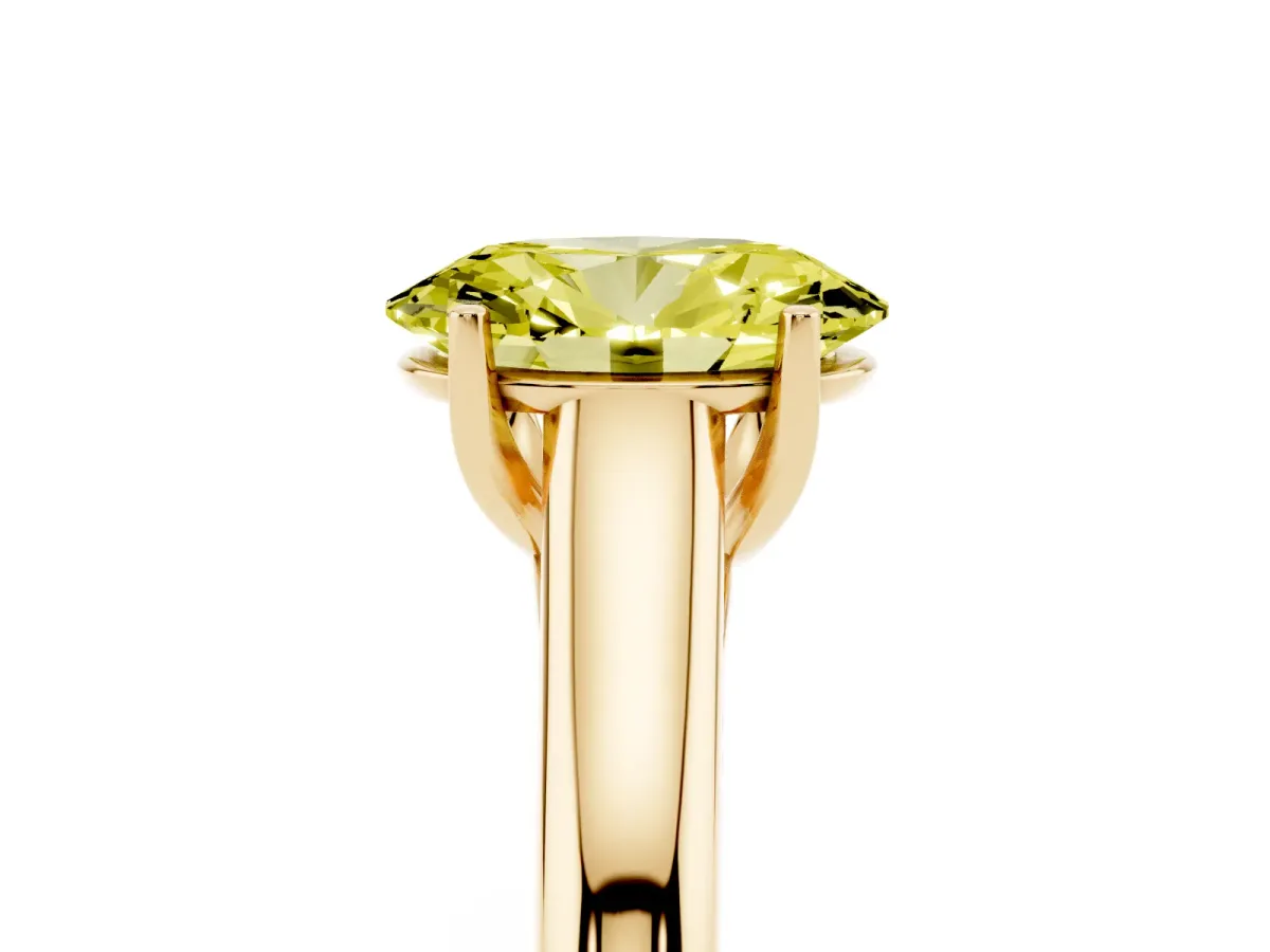 Fancy Yellow Oval Cut Solitaire Engagement Ring with Tapered Band and Four-Prong Setting Yellow gold