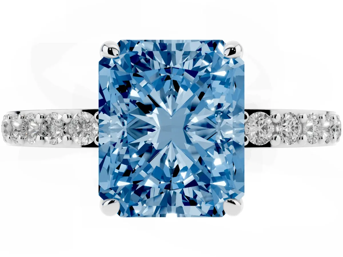 Fancy Blue Radiant Cut Diamond Pavé Engagement Ring with Round Accents and Prong Setting Silver