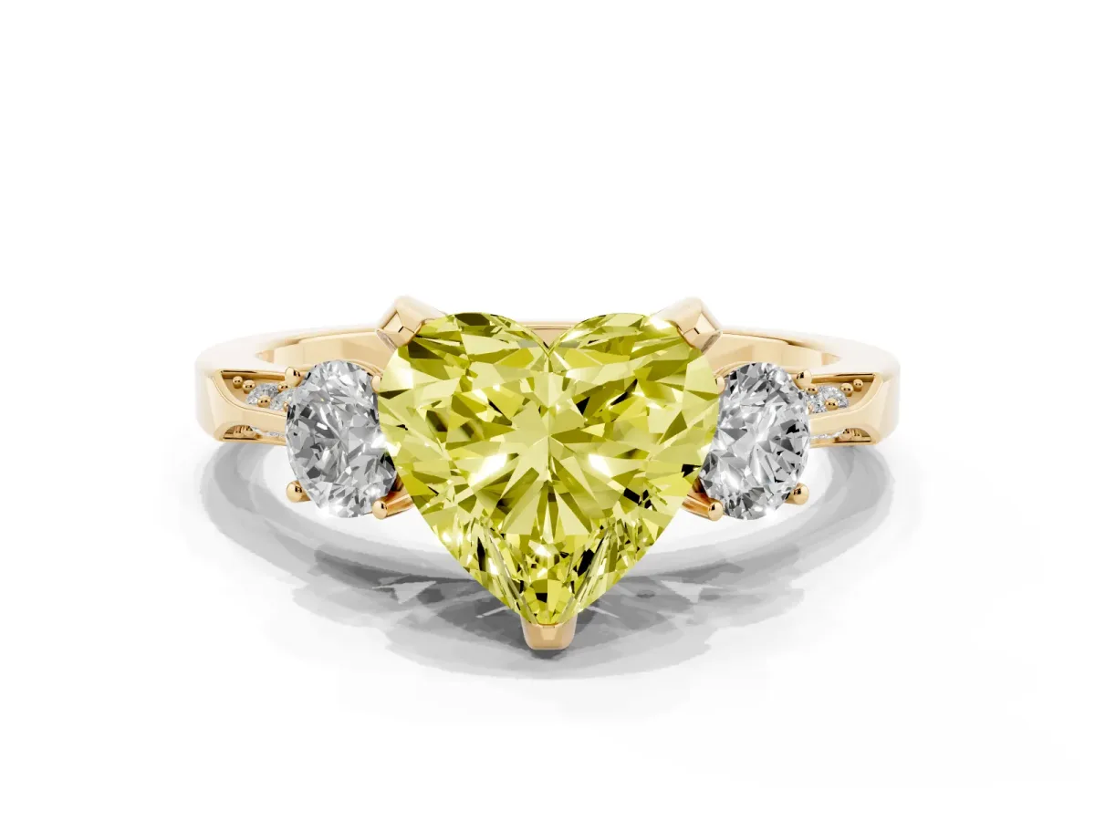 Fancy Yellow Heart Cut Brilliant Three-Stone Diamond Ring with Pavé Band and Four-Prong Setting Yellow gold